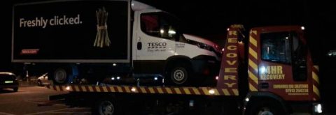 tesco van on a flatbed truck